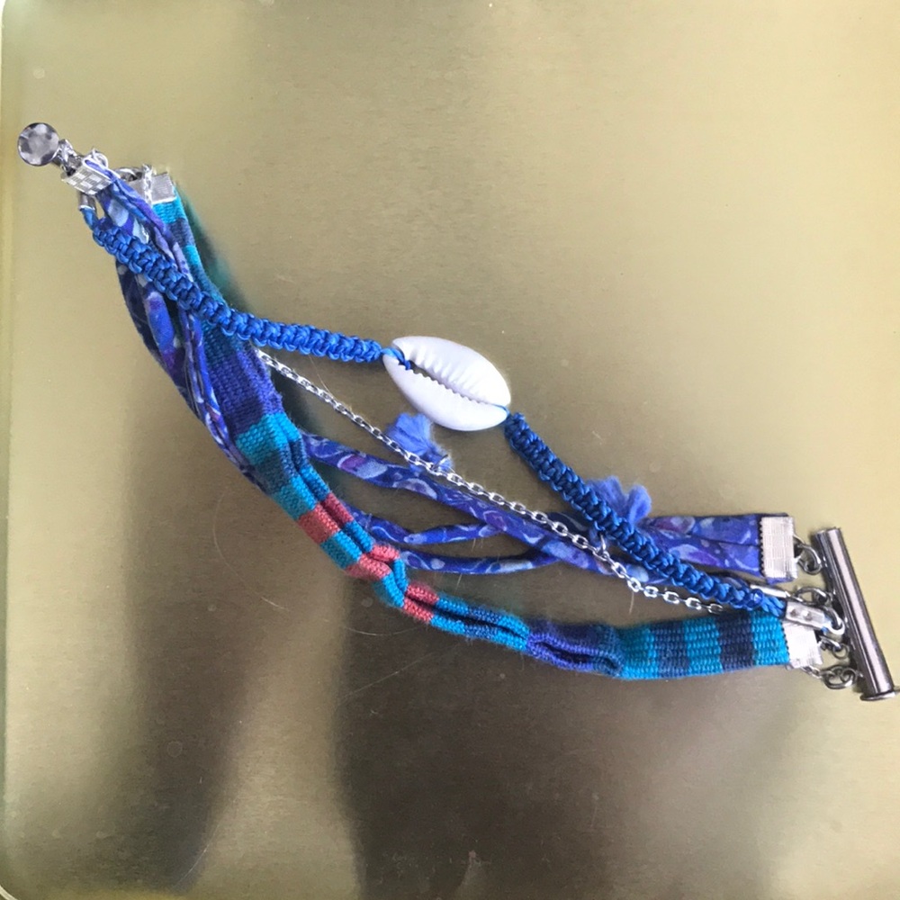 Multi strand fabric bracelet with seashell